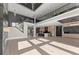 Spacious living room featuring hardwood floors, a modern kitchen, staircase, and elegant design at 1688 Mineral Springs Rd, Hoschton, GA 30548