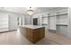 Expansive walk-in closet featuring an island, shelving, and ample storage space at 1688 Mineral Springs Rd, Hoschton, GA 30548