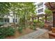 Courtyard view showing beautiful garden, benches, and brick pathways at 1850 Cotillion Dr # 2221, Atlanta, GA 30338
