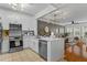 Modern kitchen featuring white cabinets, stainless steel appliances, and an island with quartz countertops at 1850 Cotillion Dr # 2221, Atlanta, GA 30338