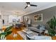 Open-concept living room with kitchen view, stylish decor, and hardwood flooring at 1850 Cotillion Dr # 2221, Atlanta, GA 30338