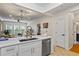 Bright and open living area with hardwood floors, large windows, and modern lighting fixtures at 1850 Cotillion Dr # 2221, Atlanta, GA 30338