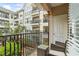 Outdoor patio with seating and a view of the building's landscaped courtyard at 1850 Cotillion Dr # 2221, Atlanta, GA 30338