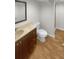 Bathroom featuring updated vanity with warm wood tones and a walk-in shower at 3113 Shiloh Pl, Canton, GA 30115