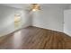 Bright bedroom features a ceiling fan and a large window with natural light at 3113 Shiloh Pl, Canton, GA 30115
