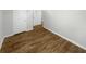 Inviting hallway features wood-look floors and crisp white trim and doors at 3113 Shiloh Pl, Canton, GA 30115