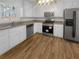 A kitchen with white cabinets, stainless steel appliances, and granite countertops at 3113 Shiloh Pl, Canton, GA 30115