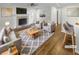A staged living room featuring a fireplace, modern furniture, and wood-look floors at 3113 Shiloh Pl, Canton, GA 30115