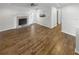 A living room featuring a fireplace, neutral walls, and wood-look floors at 3113 Shiloh Pl, Canton, GA 30115