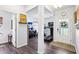 Wide view of finished basement featuring work bench, treadmill, and doorway to outside at 103 Cottage Way, Euharlee, GA 30145