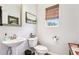 Half bathroom featuring modern pedestal sink, decorative window shade, and gray walls at 103 Cottage Way, Euharlee, GA 30145