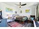 Bedroom with ceiling fan, laminate floors, and a decorative area rug at 103 Cottage Way, Euharlee, GA 30145