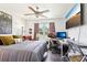 This bedroom features a ceiling fan, a large window, and a workstation perfect for a home office at 103 Cottage Way, Euharlee, GA 30145