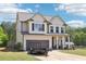 Beautiful two-story home with a well-manicured lawn, attached garage, and an inviting front porch at 103 Cottage Way, Euharlee, GA 30145