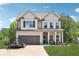 Charming two-story home with a well-manicured lawn, two-car garage, and lovely front porch at 103 Cottage Way, Euharlee, GA 30145