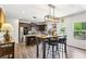 Spacious kitchen featuring stainless steel appliances, a center island with seating, and an adjoining dining area at 103 Cottage Way, Euharlee, GA 30145