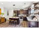 Stylish kitchen features an island with seating, stainless steel appliances, and modern cabinetry at 103 Cottage Way, Euharlee, GA 30145