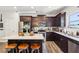 Bright kitchen featuring a center island with a stone countertop, stainless appliances, and hardwood floors at 103 Cottage Way, Euharlee, GA 30145