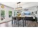 Bright and airy living room with an open layout, seamlessly connecting to the dining area and outdoor patio at 103 Cottage Way, Euharlee, GA 30145