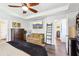 Main bedroom featuring trey ceiling, hardwood floors, and access to ensuite bathroom at 103 Cottage Way, Euharlee, GA 30145