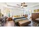 Spacious main bedroom featuring trey ceilings, hardwood floors, and ensuite bathroom at 103 Cottage Way, Euharlee, GA 30145