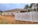 View of the home's backyard and back of the house at 113 Citadel Dr, Hampton, GA 30228