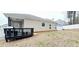 Backyard with a deck, vinyl fence, and ample room for outdoor activities at 113 Citadel Dr, Hampton, GA 30228
