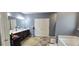 Expansive bathroom featuring dual sinks, soaking tub, and tiled floors at 113 Citadel Dr, Hampton, GA 30228