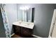 Stylish bathroom features a double sink vanity and a shower with a patterned curtain at 113 Citadel Dr, Hampton, GA 30228