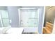 Bathroom vanity with a white shower and a glass door at 113 Citadel Dr, Hampton, GA 30228