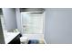Cozy bathroom featuring a shower with glass door, dark vanity, and compact toilet at 113 Citadel Dr, Hampton, GA 30228