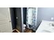 Bathroom featuring a toilet in a separate area, double vanity, and a door with a gold knob at 113 Citadel Dr, Hampton, GA 30228