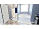 Bright bathroom with a soaking tub, walk-in shower, and modern fixtures at 113 Citadel Dr, Hampton, GA 30228
