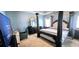 Cozy bedroom with a stylish bed, mirror, chair and large television at 113 Citadel Dr, Hampton, GA 30228