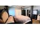 Spacious bedroom featuring a four-poster bed and dark wood furniture at 113 Citadel Dr, Hampton, GA 30228