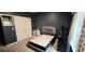 Neat bedroom features a gray bed frame, gray walls, carpeted floors, and a double door closet at 113 Citadel Dr, Hampton, GA 30228