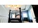 Bedroom featuring a four-poster bed and blue walls at 113 Citadel Dr, Hampton, GA 30228