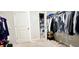 Large walk-in closet with ample shelving and storage racks at 113 Citadel Dr, Hampton, GA 30228