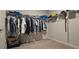 Walk-in closet with hanging racks and shelves, ready for organization and storage at 113 Citadel Dr, Hampton, GA 30228