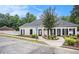 Exterior of community clubhouse and manicured landscaping at 113 Citadel Dr, Hampton, GA 30228