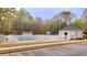 Community pool with splash pad fenced in for safety at 113 Citadel Dr, Hampton, GA 30228