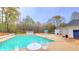 Community pool with ample seating and splash pad in background at 113 Citadel Dr, Hampton, GA 30228