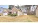 Charming single-story home features brick accents, manicured landscaping, and a two-car garage at 113 Citadel Dr, Hampton, GA 30228