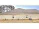 Home exterior with visible siding, windows, roof, and air conditioning unit at 113 Citadel Dr, Hampton, GA 30228