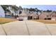 Traditional home with a two-car garage, driveway, and landscaping at 113 Citadel Dr, Hampton, GA 30228