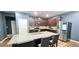 Charming kitchen features granite countertops, ample cabinet space, and stainless steel appliances at 113 Citadel Dr, Hampton, GA 30228