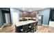 Granite countertops, stainless steel appliances, and a stylish island elevate this kitchen space at 113 Citadel Dr, Hampton, GA 30228