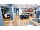 A well-lit kitchen boasts an island with seating, stainless steel appliances, and dark wood cabinets at 113 Citadel Dr, Hampton, GA 30228