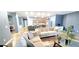 Bright living space with hardwood floors, kitchen, desk, and neutral furniture is very inviting at 113 Citadel Dr, Hampton, GA 30228