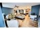 Open-concept living room featuring hardwood floors and recessed lighting throughout at 113 Citadel Dr, Hampton, GA 30228